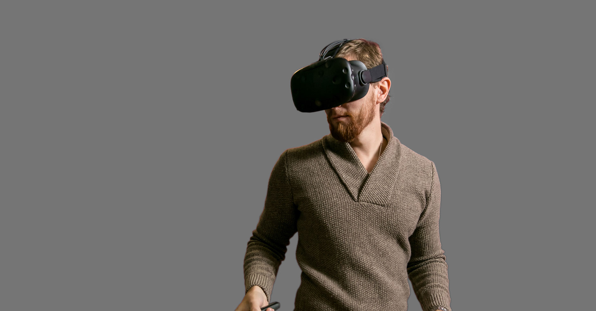 A man uses his VR headset for VR modeling.